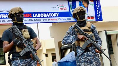 Officers from the Anti-terror Police Unit stand guard at the DCI National Forensic Lab