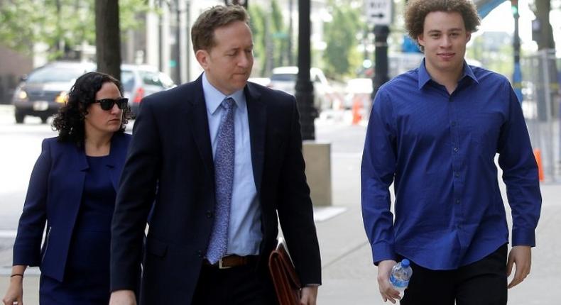 Marcus Hutchins (R), the British cyber security researcher accused of creating and selling malware that steals banking passwords, appeared at a court hearing Monday in Milwaukee, Wisconsin with his lawyers Marcia Hofmann and Brian Klein