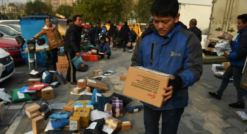 Packages are sorted for deliveries during the 'Double Eleven' Online Shopping Festival day in Beijing, on November 11, 2016