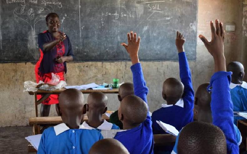 A teacher at Shauri Yako Primary school in Homa Bay town teaches grade four pupils