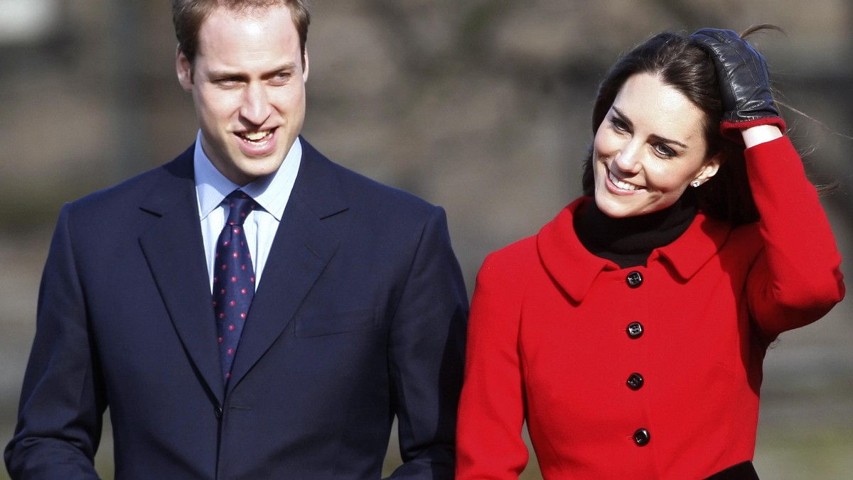 Britain's Prince William and his fiancee Kate Middleton smile during a visit to St. Andrews Universi