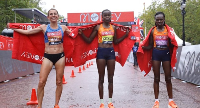  Left to right: Sara Hall, winner Brigid Kosgei, & Ruth Chepngetich pose for a photograph on The Mall