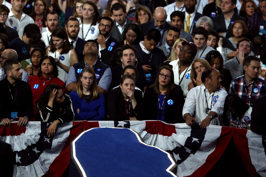 People watching voting results at Clinton's event at the Javits Center.