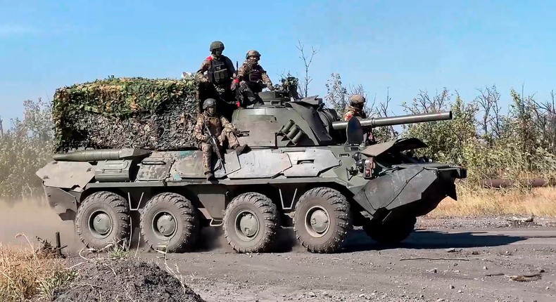 Russian soldiers ride a self-propelled mortar at an undisclosed location in Ukraine in October.Russian Defense Ministry Press Service via AP