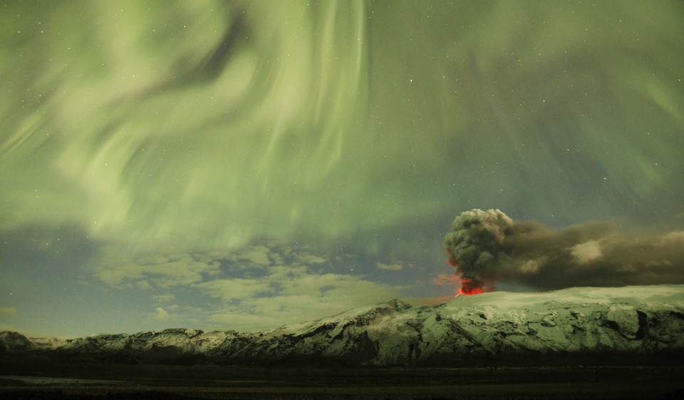 The Northern Lights are seen above the ash plume of Iceland's Eyjafjallajokull volcano in the evening April 22, 2010.