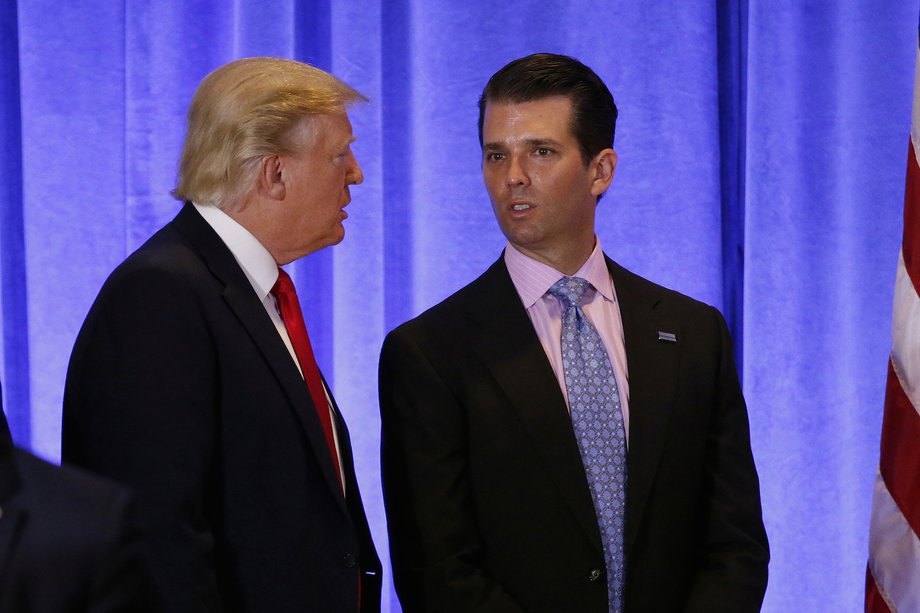 U.S. President-elect Donald Trump speaks with his son Donald Trump Jr. during a news conference in the lobby of Trump Tower in Manhattan, New York City, U.S., January 11, 2017.