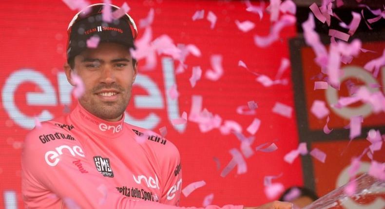 Netherlands' Tom Dumoulin of team Sunweb celebrates the Pink Jersey of the overall leader on the podium after the 18th stage of the 100th Giro d'Italia, Tour of Italy, cycling race from Moena to Ortisei on May 25, 2017