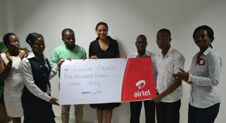 Hannah Agbozo, Legal & Corporate Affairs Director (Middle) and Maruf Lawal, Networks& IT Director (3rd from Left) making the presentation to Mr. Francis Abotsi (2nd from right)