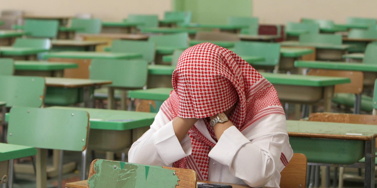 A secondary-school student sits for an exam.