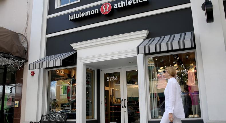 A woman walks past a Lululemon Athletica store in Miami, Florida in 2013.