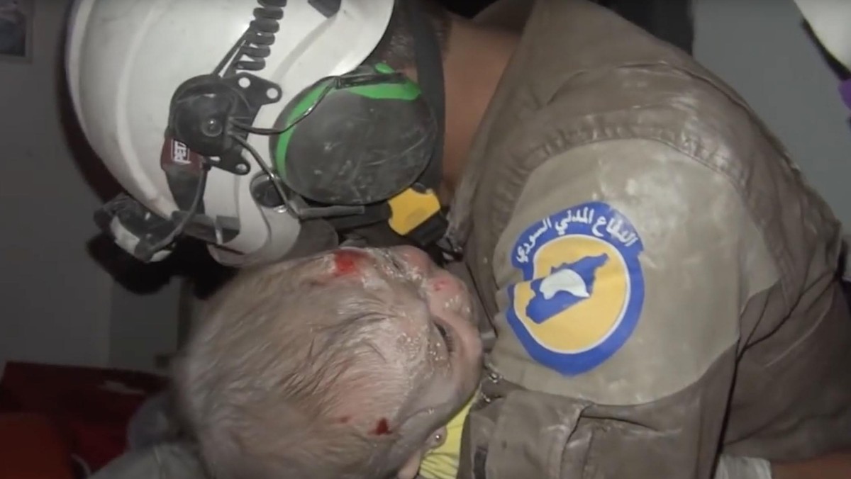 Rescue volunteer bursts into tears after rescuing a baby girl caught in Assad bombings