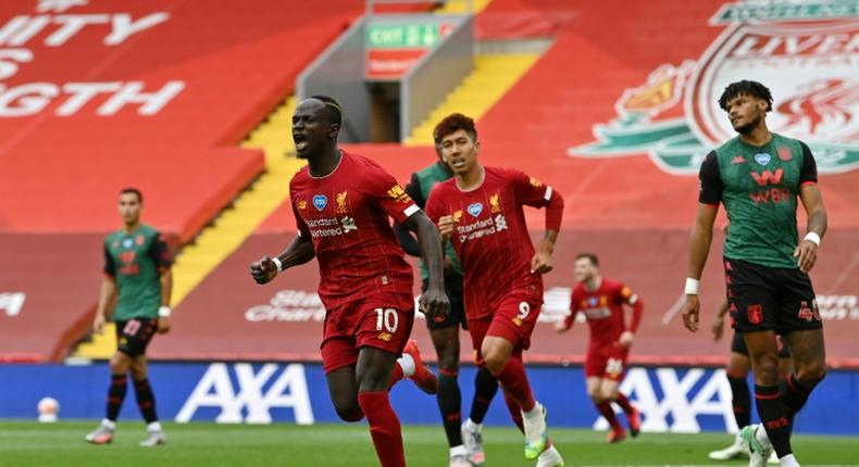 Sadio Mane (centre) celebrates his 20th goal of the season for Liverpool