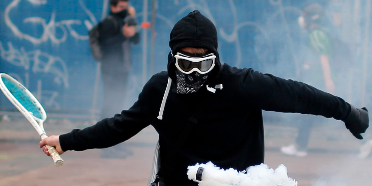 A protester returning a tear-gas canister during a demonstration to protest the government's proposed labor-law reforms in Nantes, France, on Thursday.
