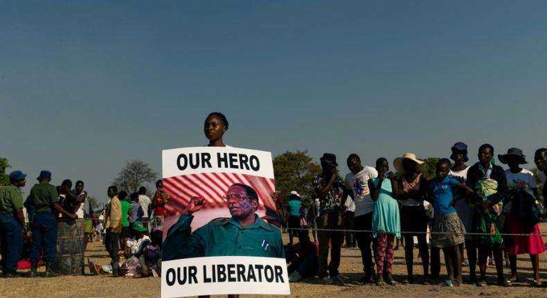 Mugabe's body was greeted to a low-key farewell in his home village