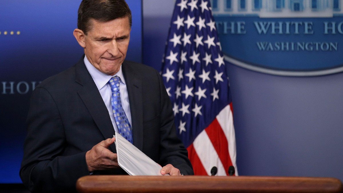 National security adviser General Michael Flynn (L) arrives to deliver a statement next to Press Sec