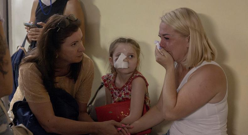 A woman reacts as people shelter in the basement of the Okhmatdyt Children's Hospital following a Russian missile strike on one of its buildings in Kyiv, Ukraine on July 8, 2024.REUTERS/Thomas Peter