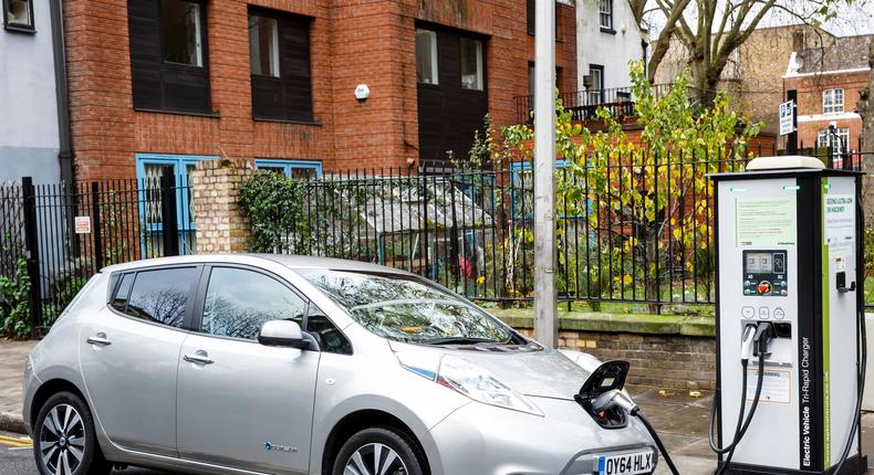 A Nissan Leaf being charged up on the streets on London.