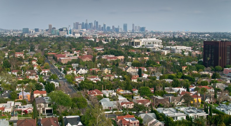 Drone shot of homes in the Mid-Wilshire neighborhood of Los Angeles, California.halbergman/Getty Images