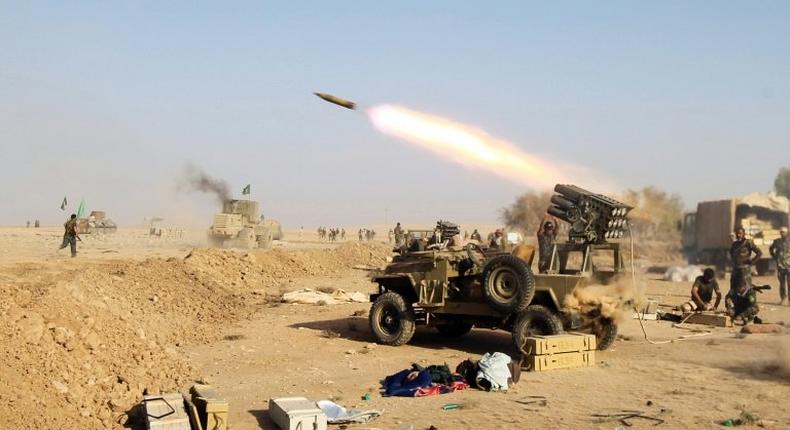 Shiite fighters from the Hashed al-Shaabi launches missiles on the village of Salmani, south of Mosul, on October 30, 2016