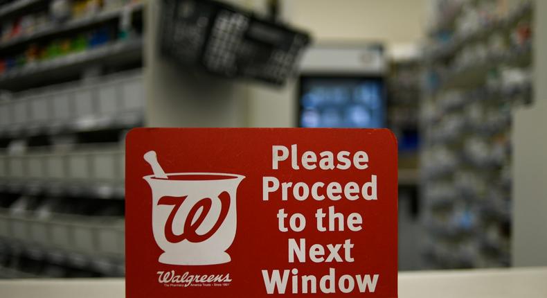 FILE PHOTO: A sign rests on a counter at a Walgreens pharmacy store in Austin, TX, U.S., March 26, 2018. REUTERS/Mohammad Khursheed