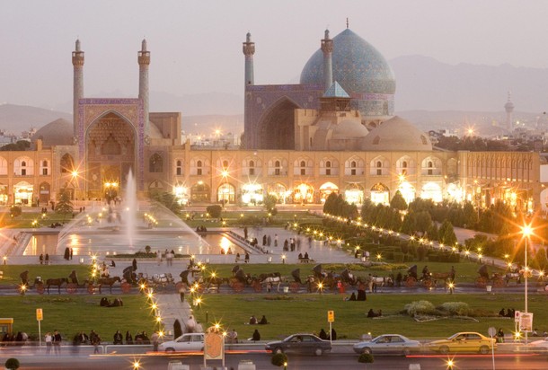 Iran - Veiled woman in front of mosque in Isfahan