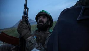 A Ukrainian serviceman of the 25th Separate Airborne Brigade monitors the sky as he rides in a car near the front line around Pokrovsk, in Ukraine's Donetsk region, on August 31.Radio Free Europe/Radio Liberty/Serhii Nuzhnenko via REUTERS