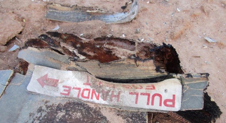 Debris is seen at the crash site of Air Algerie flight AH5017 near the northern Mali town of Gossi, July 24, 2014.  REUTERS/Burkina Faso Military/Handout via Reuters