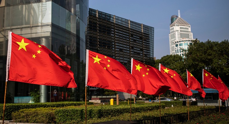 The national flag of China is displayed in a street in Wuhan, Hubei province, China.Getty Images