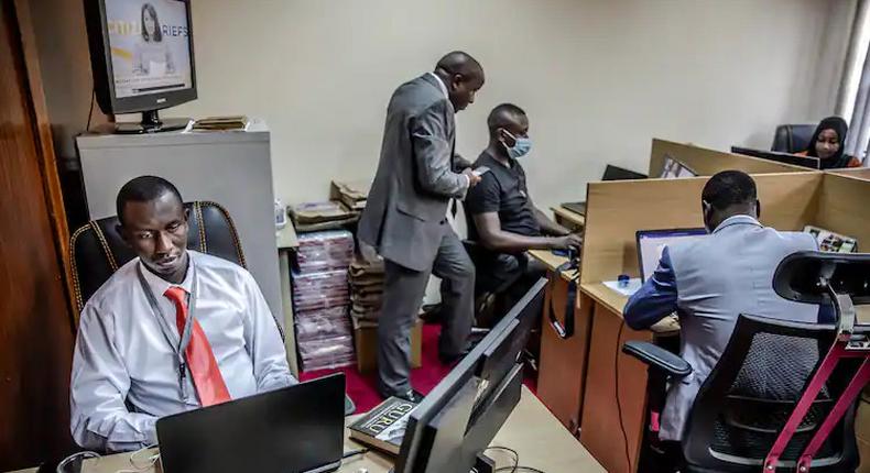 Police officers work on reports and social media posts in the DCI’s communications department. 