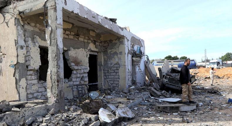 General view of damage at the scene of an explosion at the Mislattah checkpoint near Khoms, on the coast road between Tripoli and Misrata Libya November 24, 2015. REUTERS/Stringer