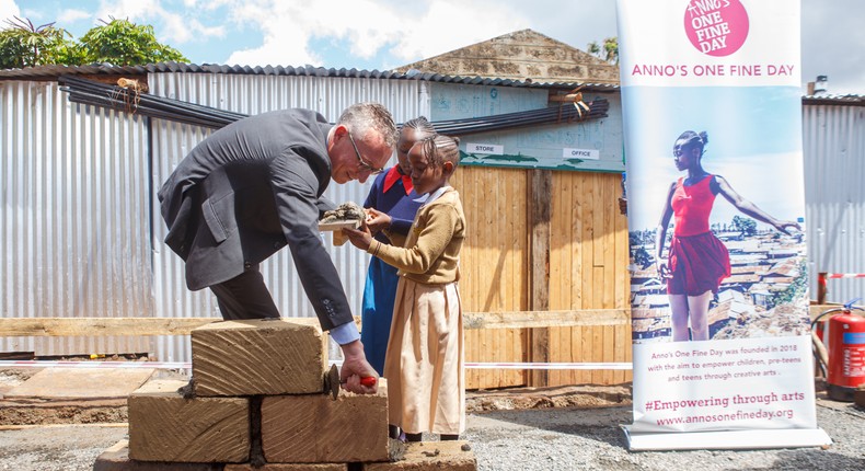 German Ambassador to Kenya, Sebastian Groth and children during the foundation laying of Arts Center Kibera project in Kibera 