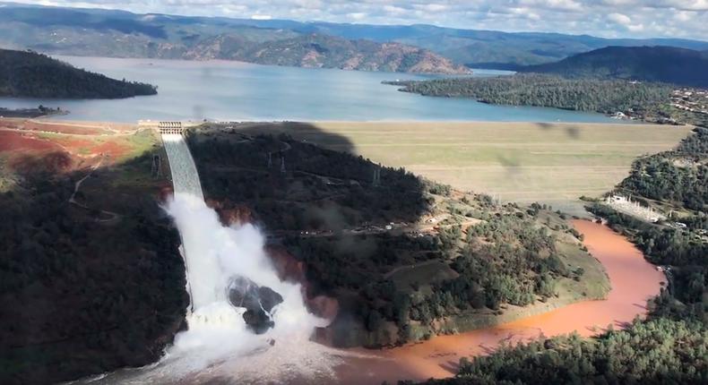 Water flows over a spillway of the Oroville Dam in California on February 10, 2017.