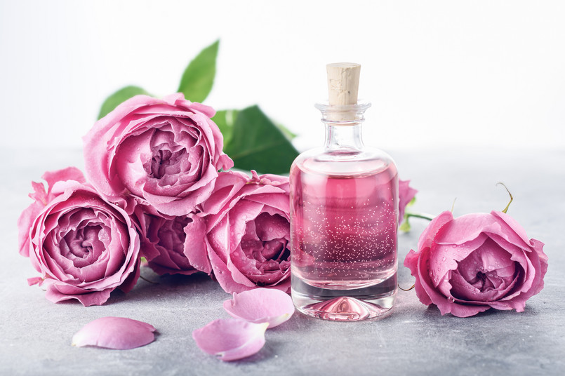 Perfumed,Rose,Water,In,Glass,Bottle,,Roses.