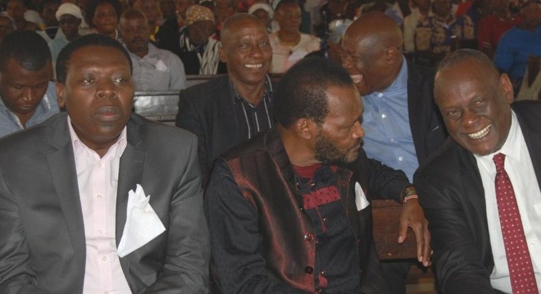 President Kenyatta's cousin Ngengi Muigai (C) speaks with former Jubilee Vice Chair David Murathe (Twitter)