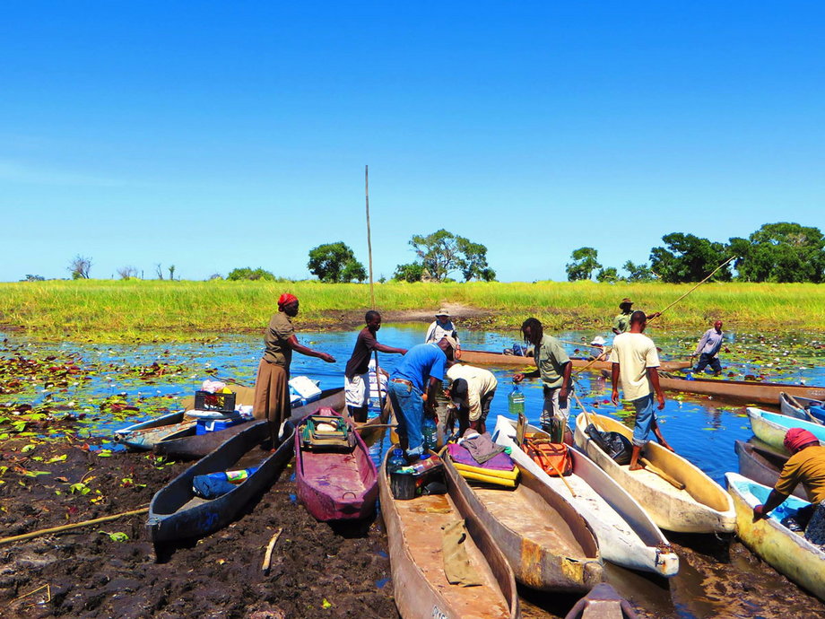 Once they arrived, they hopped on some mokoros. These traditional wooden canoes are a common form of transportation in the Okavango Delta since they can easily navigate through the area's extremely shallow waters.