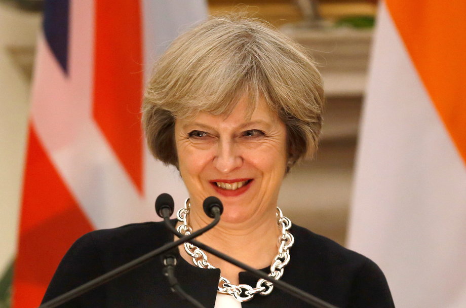 Britain's Prime Minister Theresa May smiles as her Indian counterpart Narendra Modi (unseen) reads a joint statement at Hyderabad House in New Delhi, India, November 7, 2016.