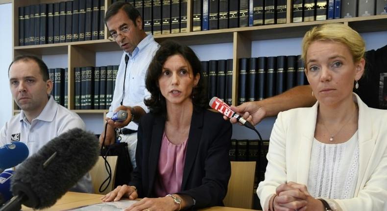 Lorient's prosecutor Laureline Peyrefitte (C) gives a press conference along with vice-prosecutor Cecile Flamet (R) and police chief Jonathan Rey (L) on July 13, 2017 in Lorient, western France, after three human foetuses were discovered