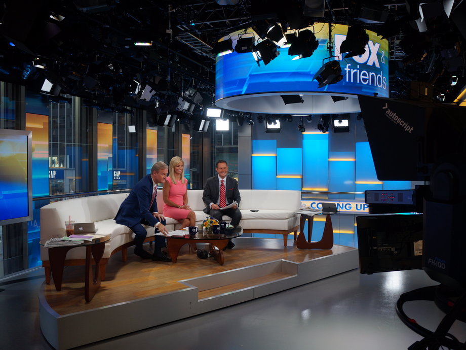 Ainsley Earhardt with her Fox & Friends co-hosts Steve Doocy, left, and Brian Kilmeade, right.