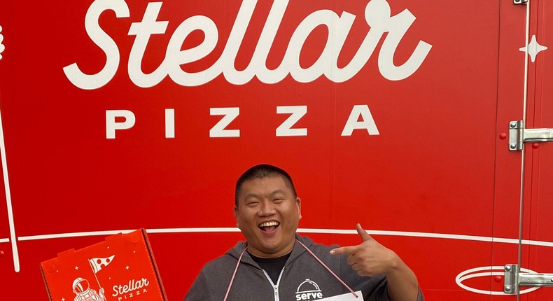 Stellar Pizza CEO Benson Tsai standing outside truck.