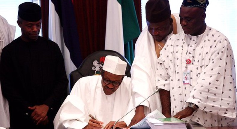 President Muhammadu Buhari signs 2016 budget on May 6, 2016