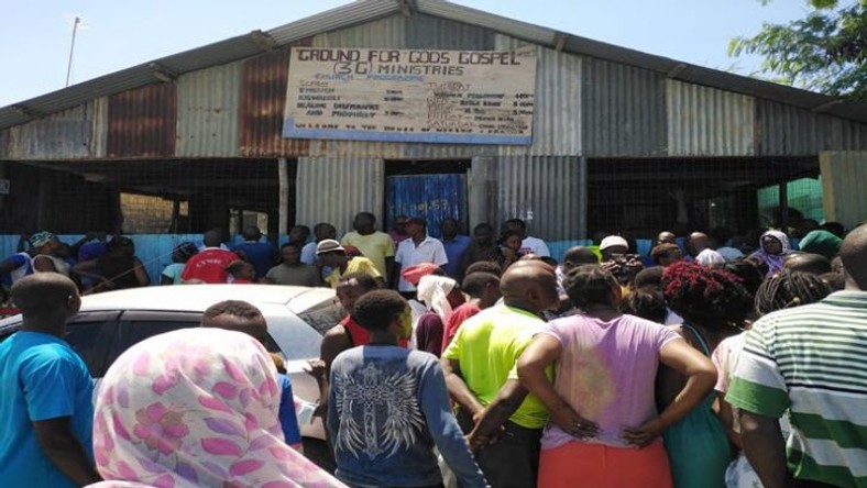 A crowd at the scene where pastor Elijah Misiko of Ground for God’s Gospel 3G Ministries in Mombasa stabbed his wife before committing suicide