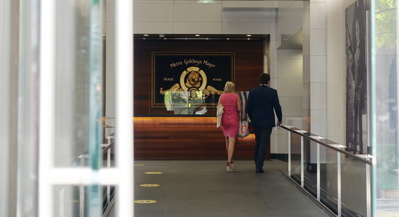 People walk into the Metro-Goldwyn-Mayer Studios office building on May 26, 2021 in Beverly Hills, California.Kaelin Mendez/Getty Images