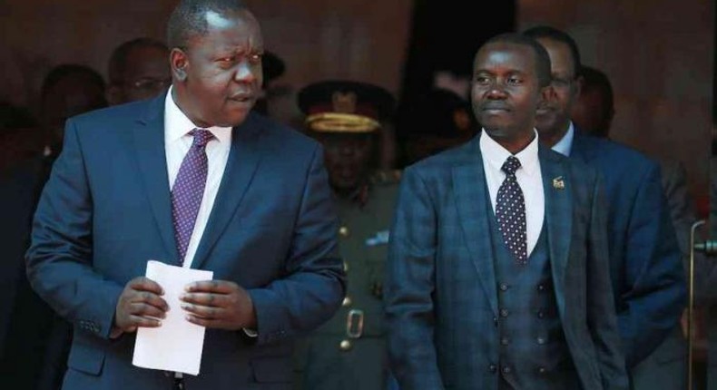 Interior CS Fred Matiang'i and ICT CS Joe Mucheru. Government takes action after M-Pesa outage