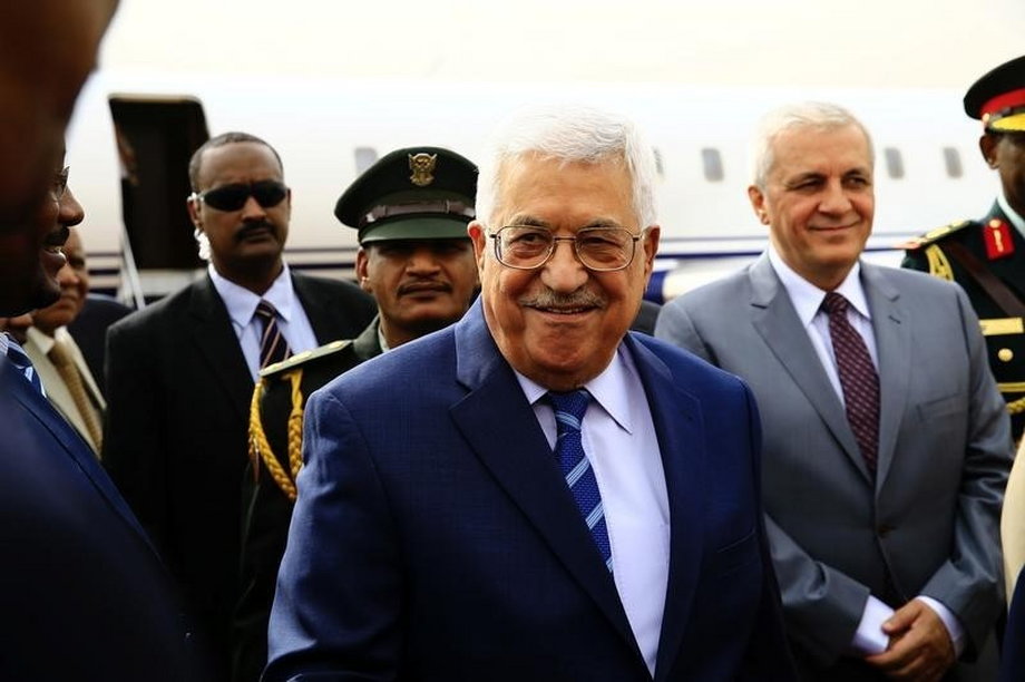 Palestine President Mahmoud Abbas smiles during his arrival for an official visit at Khartoum Airport in Sudan
