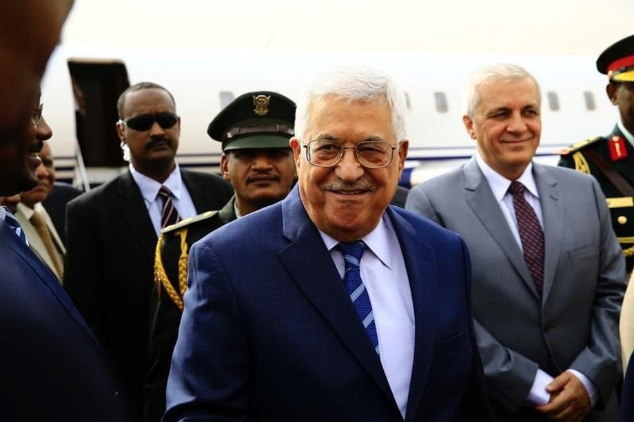 Palestine President Mahmoud Abbas smiles during his arrival for an official visit at Khartoum Airport in Sudan