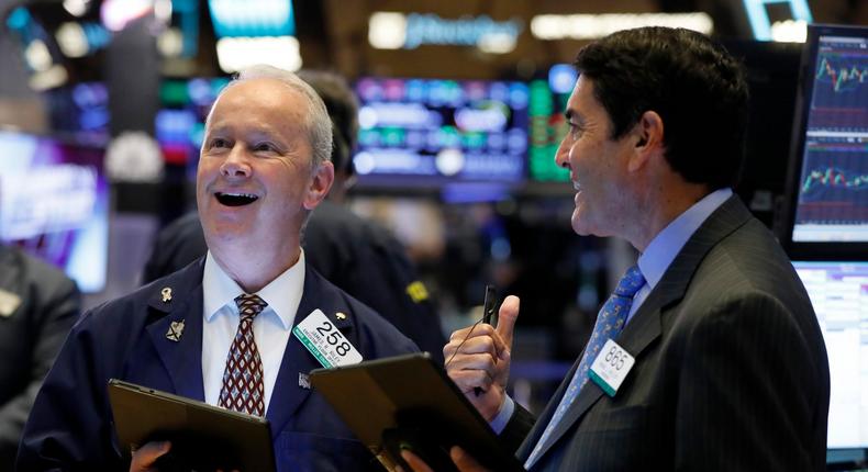 FILE - In this July 22, 2019, file photo traders James Riley, left, and Mark Muller work on the floor of the New York Stock Exchange. The U.S. stock market opens at 9:30 a.m. EDT on Thursday, Aug. 1. (AP Photo/Richard Drew, File)