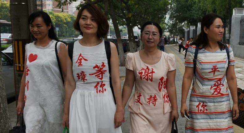 Chen Guiqiu (3rd L), the wife of detained human rights lawyer Xie Yang, is seeking US asylum after fleeing China on foot and brazenly escaping a Thai jail with her two daughters, aided by US officials