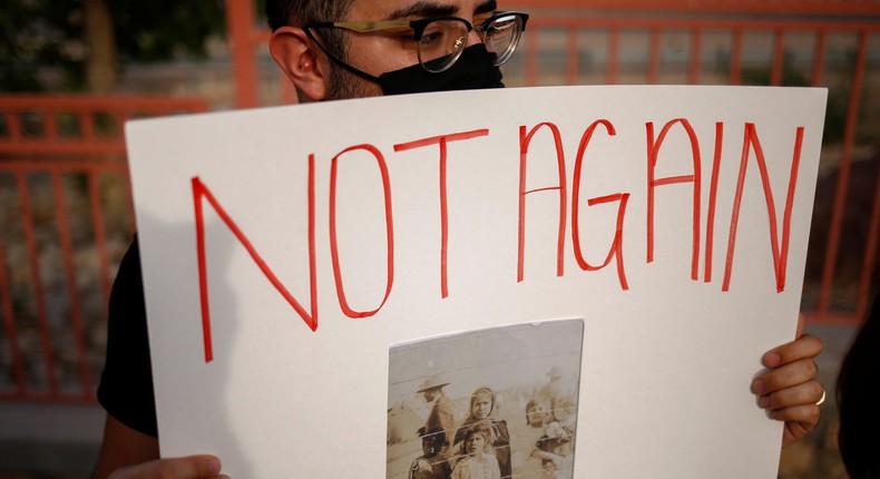 Activist defending the rights of migrants holds a protest near Fort Bliss to call for the end of the detention of unaccompanied minors at the facility in El Paso, Texas, U.S, June 8, 2021.
