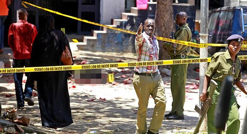 Police officers at a past crime scene