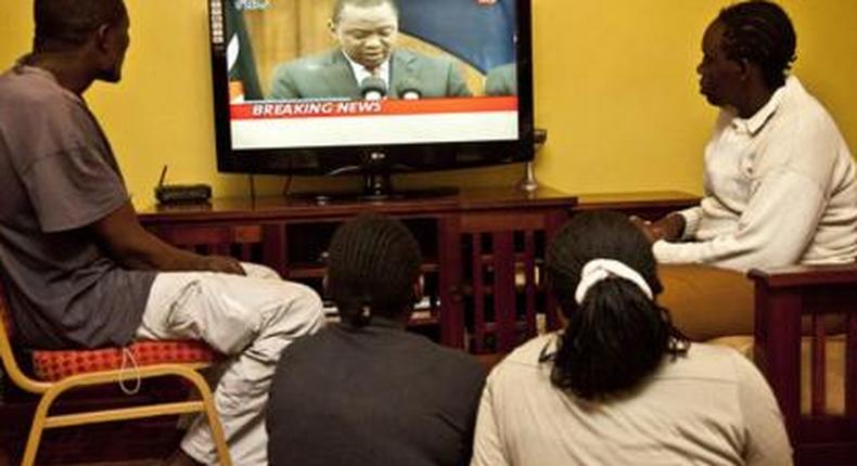 Kenyans watching TV